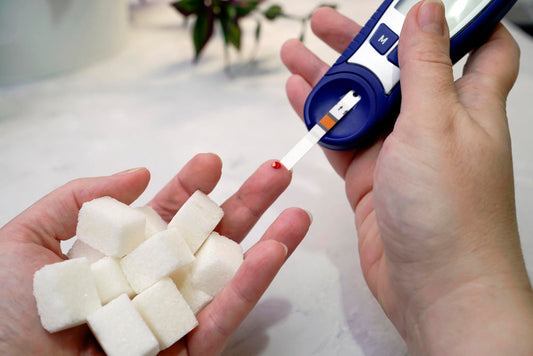 a lady testing her blood suger level with a tester