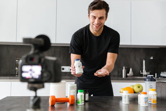 a young man making videos of supplements for marketing