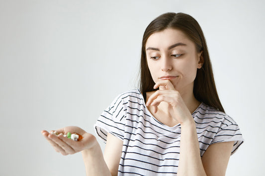 a young women is confused about choosing the right supplements
